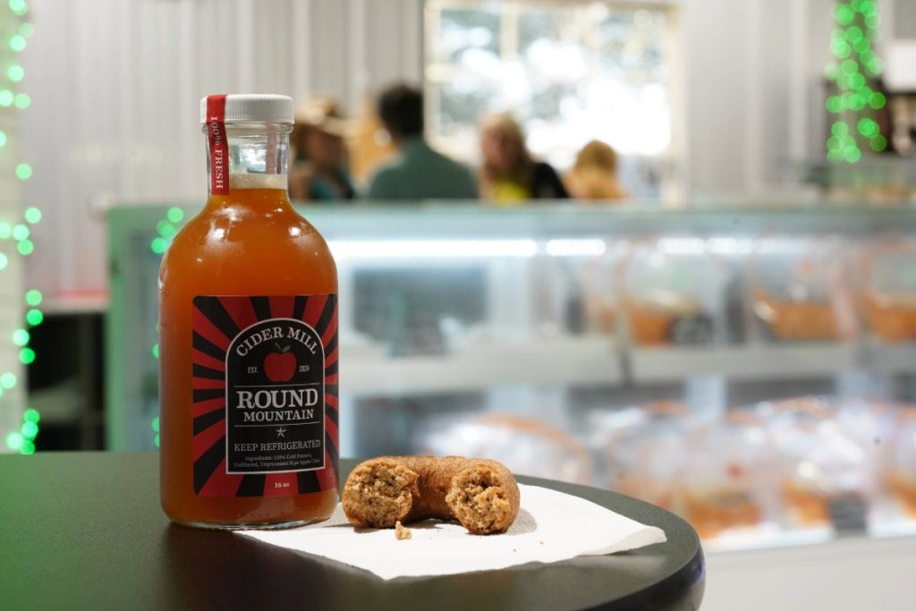 Apple cider and part of a donut