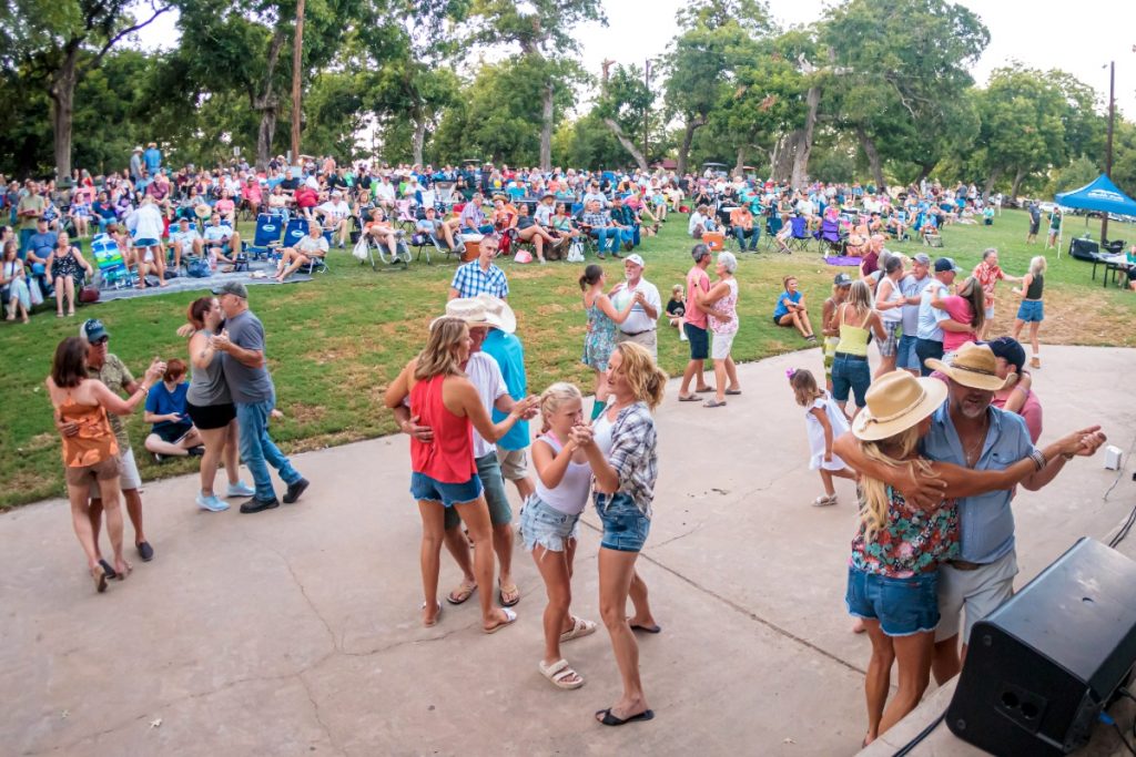 People dancing at an outdoor concert