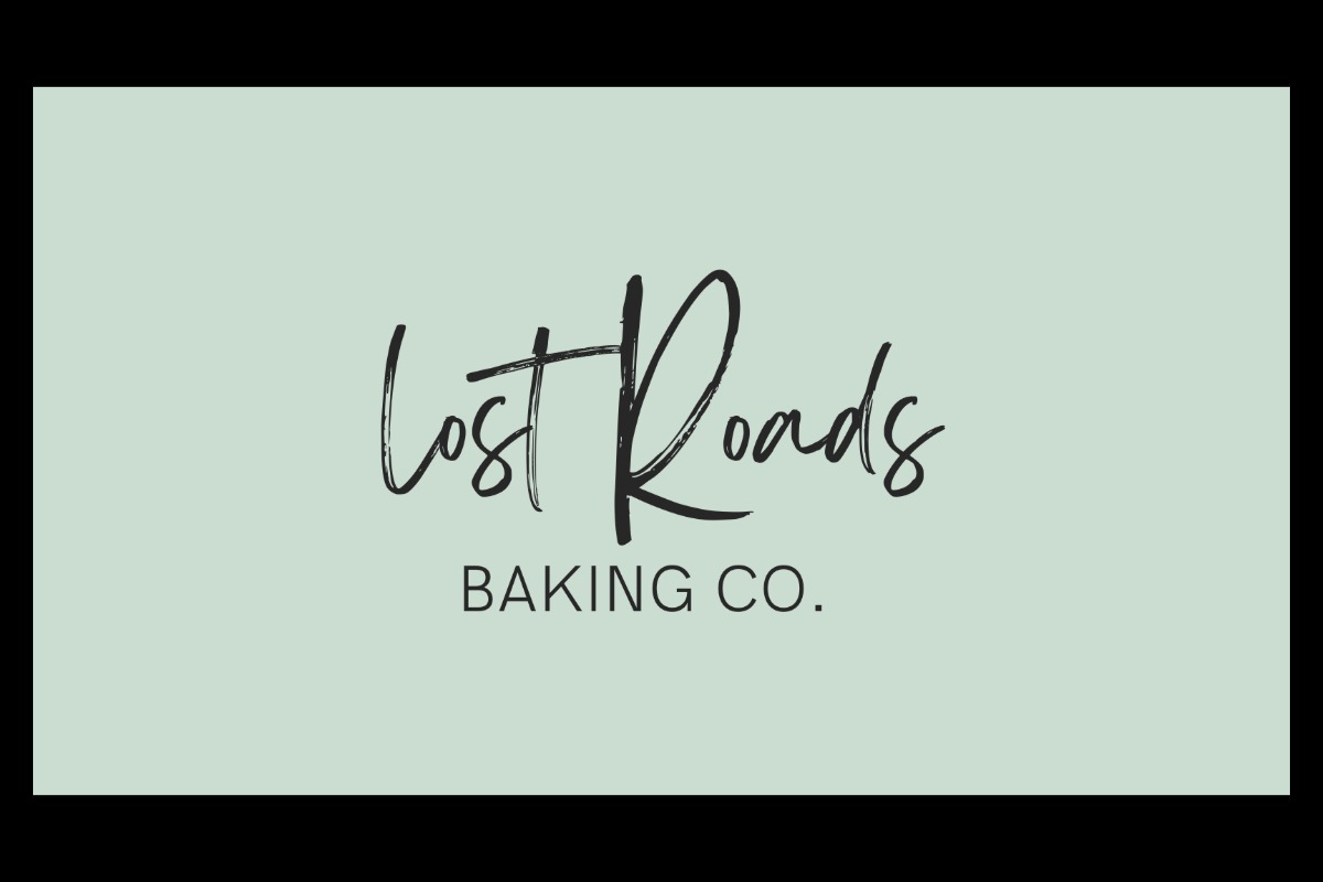 Logo with the words Lost Roads Baking in a large, handwritten script and Baking Co. in smaller, uppercase printed letters, all on a pale green background with a black border.