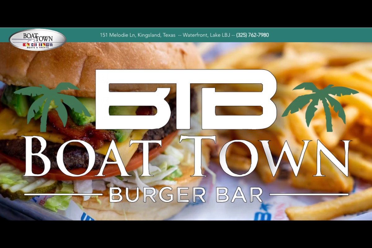 Close-up of a cheeseburger with lettuce, tomato, and pickles next to a pile of French fries. Overlaid text reads Boat Town Burger Bar with the BTB logo and palm trees. Boat Town Burger Bar’s address and phone number appear at the top.