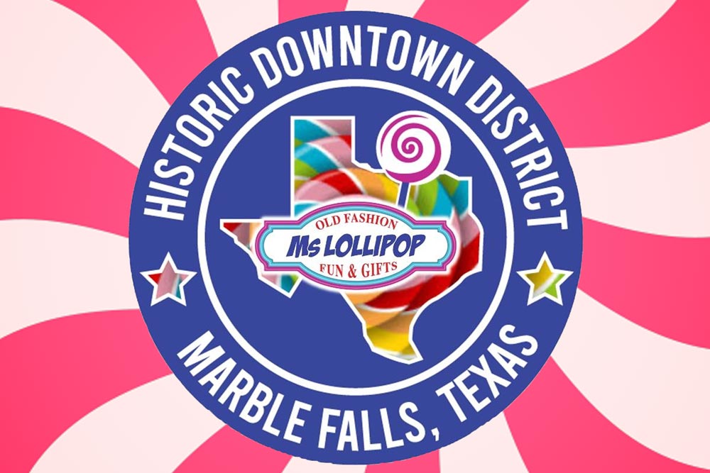 A colorful circular logo for the Historic Downtown District in Marble Falls, Texas, located in Burnet County, featuring a Texas shape filled with candy patterns and a lollipop. “Ms Lollipop Fun & Gifts” is centered with pink and white swirls in the background.
