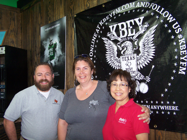 KBEY 103.9 FM Radio Picayune's JBar Weekend Restroom Report's Jason Jamar (left) and Sandy Boulter and Rachel King of the Highland Lakes Farmers' Market.