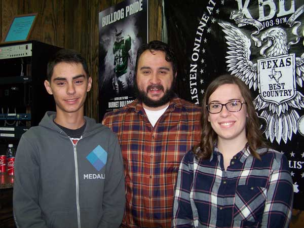 Marble Falls High School theater arts teacher Jon Clark with students Endrit Bislimi and Ellie Isaack.