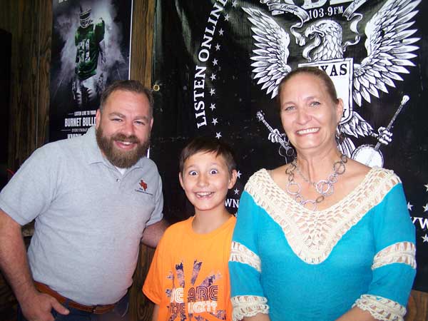 Jason Jamar of the 'JBar Weekend Restroom Report' with guests Wendy Taylor of the Kingsland Chamber and her son, Trevor.