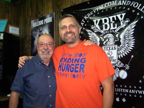 KBEY's Ed Chandler (left) with Chad Nelson of the Burnet County Hunger Alliance.