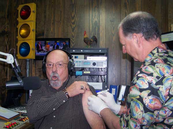 Kevin Atkins of Atkins Pharmacy gives KBEY's Ed Chandler his flu shot. You can get your flu shots at the Marble Falls pharmacy.