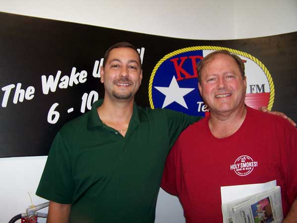 KBEY 103.9 FM guest Randy Mayville (right) of Holy Smokes BBQ and KBEY advertising rep Doug Rudd.