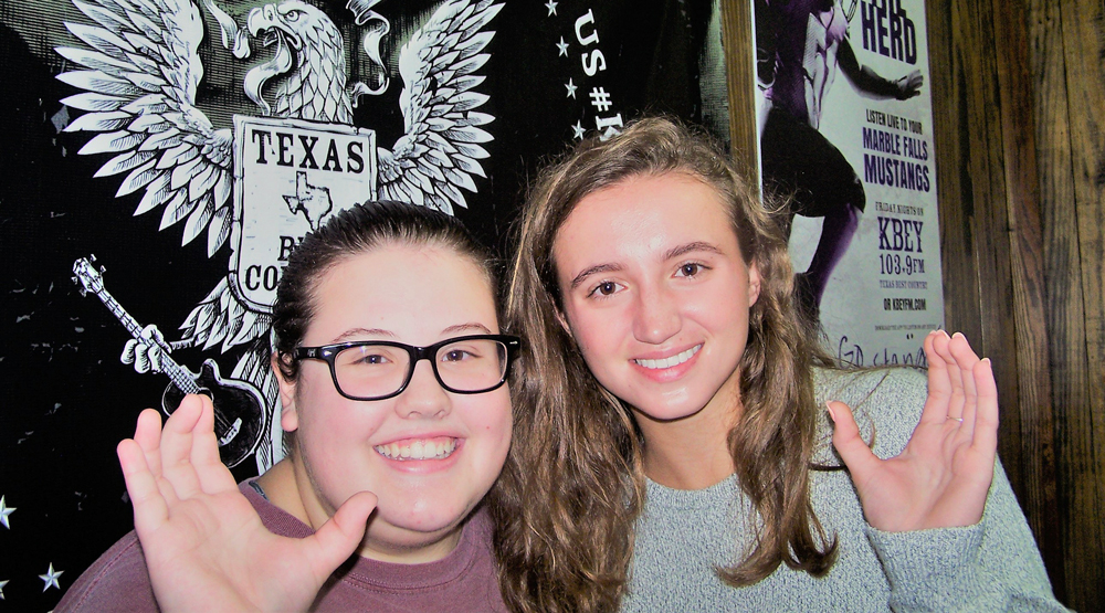 KBEY 103.9 FM guests Abbi Collard (left) and Virginia Baskin, Marble Falls High School student council officers, talk about Homecoming Week.