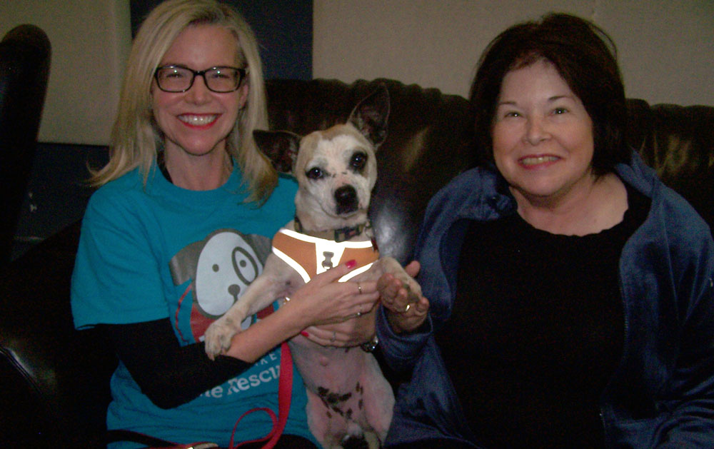 Carol Walterscheidt and Lisa Keller of Highland Lakes Canine Rescue and Dobby