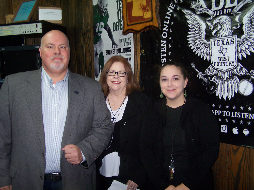 Dr. Sandra Phelps and Tabitha Thompson of First Baptist Christian School and Kirk Noaker, vice president of the Parent Teacher Fellowship