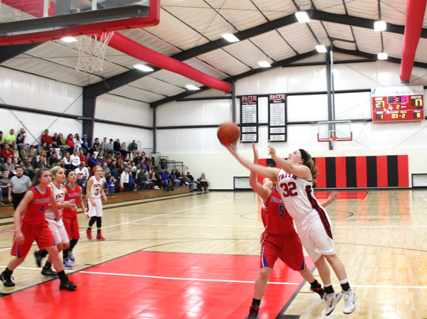 Faith Academy sophomore guard Hannah Marks leans in for layup.
