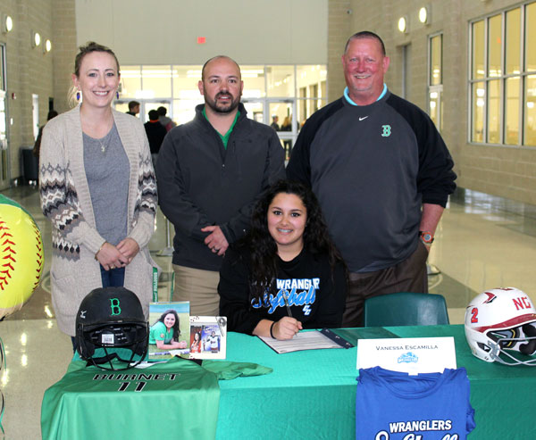 Burnet High School senior softball player Vanessa Escamilla (seated) signs her letter of intent to play for Cisco College on Feb. 3 Celebrating the day with her are Stephanie Bledsoe (standing, left), the wife of head coach Corey Bledsoe (center), and assistant coach Brent Kelley. Staff photo by Jennifer Fierro