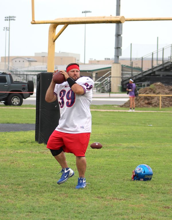 Burnet County Cowboys quarterback Jimmy Gibbs warms up before starting practice April 28. Staff photo by Jennifer Fierro