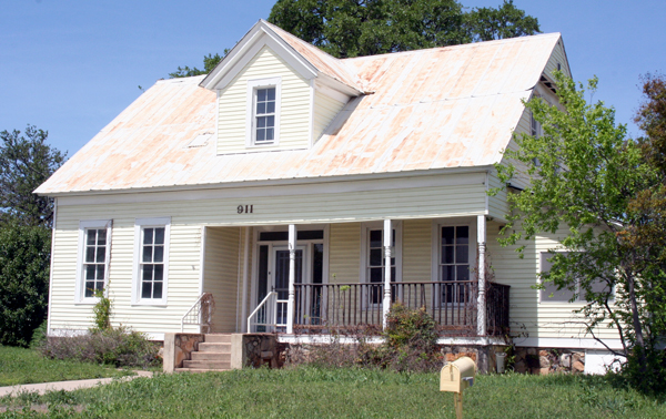 A Marble Falls businessman has purchased an 111-year-old home to save it from demolition. His plans include moving it four blocks away to refurbish and keep it as a dwelling for his family. Staff photo by Connie Swinne