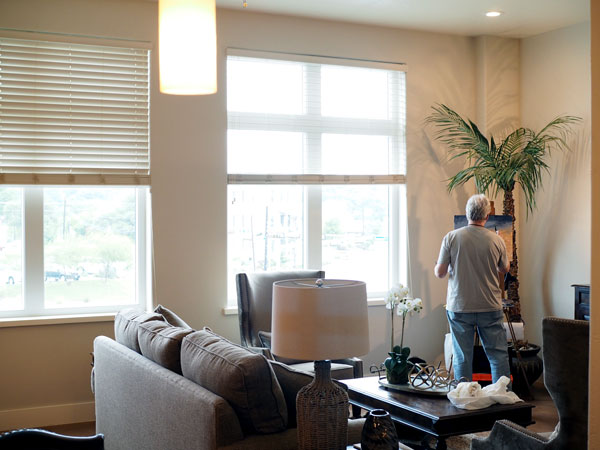 Gary Frisk enjoys a great view of the Blue Bonnet Cafe from one of the suites on the second floor of the new Market on H, 206 Ave. H in Marble Falls. The 15,000-square-foot building has already leased out its retail and office space, but the owners — Stuart and Rebecca Nunnally — created two suites available for overnight to week-long stays. Frisk found a little refuge from the cold, wet weather April 1 during Paint the Town, but the suites and building put people in the heart of Marble Falls within easy walking distance of Main Street and other shopping and dining locations.