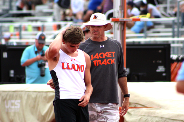 Llano High School senior pole vaulter Cody Miller receives words of encouragement from athletic director and head coach Craig Slaughter after Miller finished competing at the Class 4A meet May 13.