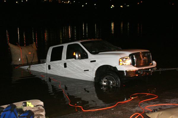 A woman and two children escaped from a pickup truck June 26 after it slid from a boat ramp into Lake Marble Falls. Crews were able to float the vehicle and pull it out without incident. Staff photos by Connie Swinney
