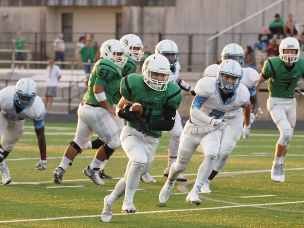 Burnet's Tyler Ford rumbles down the field during the Bulldogs' season opener against Austin Reagan Raiders. Burnet won 55-12. Courtesy photo by Glenn Morris/ftmog.com