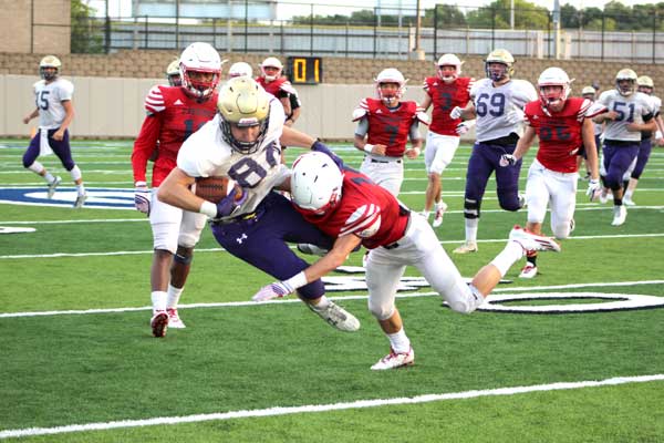 Marble Falls High School senior receiver Cade Cool catches a pass in traffic for a first down during a scrimmage against Georgetown East View on Aug. 18. The Mustangs open the season at home Aug. 26 against Bastrop Cedar Creek. Kickoff is 7:30 p.m. Tune in to the game on KBEY 103.9 FM Radio Picayune or at KBEYFM.com starting with a pregame show at 6:30 p.m. Staff photo by Jennifer Fierro