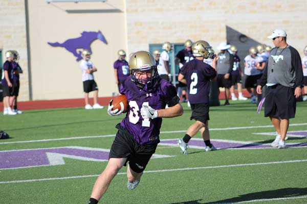 Marble Falls sophomore running back Cooper Wilson looks for running room.