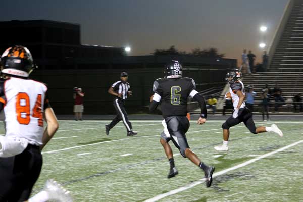 Llano junior receiver Anthony Watson is on his way to scoring the second touchdown of the Yellow Jackets’ 62-7 win against Austin Eastside Memorial on Sept. 29. Watson had three catches for 53 yards and two touchdowns. Staff photo by Jennifer Fierro