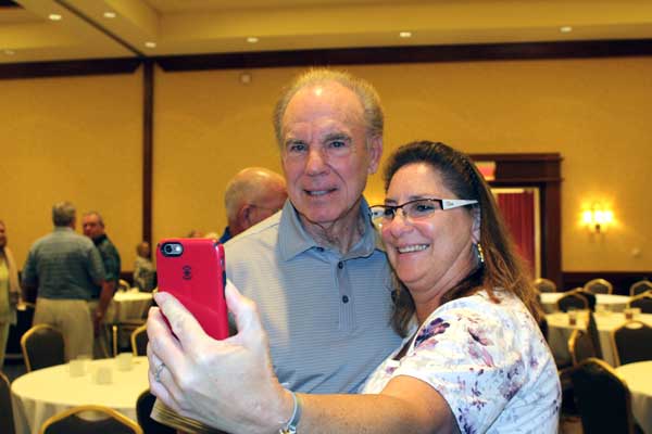 Michele Kesler was one of numerous individuals to listen to legendery Dallas Cowboys quarterback Roger Staubach speak during a gathering of the Horseshoe Bay Sports Club on Sept. 21. The two posed for a photo. Staff photo by Jennifer Fierro