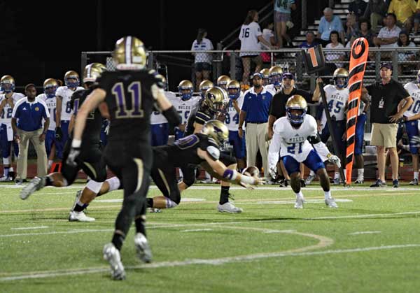 Marble Falls High School senior linebacker Heath Dooley goes low to make an interception in the Mustangs’ 41-16 loss to San Antonio Alamo Heights on Sept. 16. It was the District 26-5A opener for both teams. Marble Falls travels to Castroville on Sept. 23 to take on the Medina Valley Panthers. Kickoff is at 7:30 p.m. Listen to the game on KBEY 103.9 FM Radio Picayune or at KBEYFM.com starting with a pregame show at 6:30 p.m. Photo by Diana Cox
