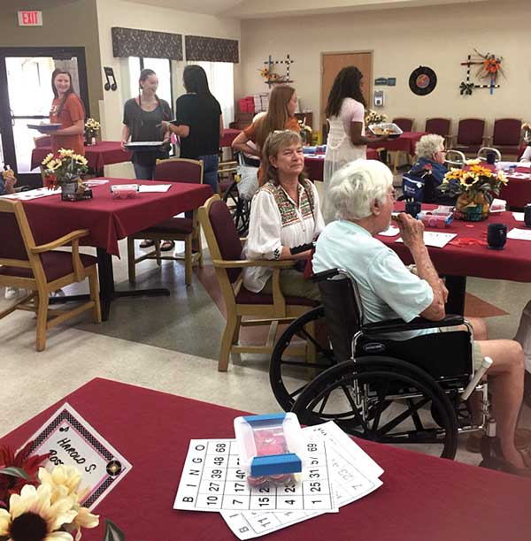 The Marble Falls High School volleyball team visited the residents at Granite Mesa Health Center and brought homemade cookies to pass out. New head coach Jessica Withrow said that’s one of many service projects coaches and players are performing with the aim of planting a seed for service in the hearts of the students. Courtesy photo