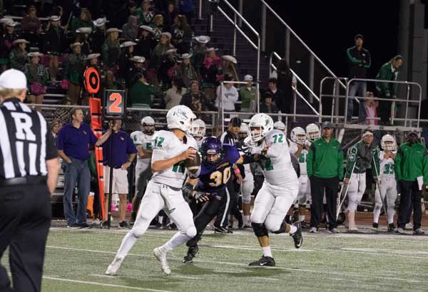 Burnet’s Rowdy Holmes drops back for a pass as offensive lineman Carlos Herrera forces Liberty Hill’s Jonathon Dudgeon to the outside. Liberty Hill won the game 44-23 on Oct. 21. The Bulldogs are at home against Lampasas on Oct. 28 with a 7:30 p.m. kickoff. Listen to the game on KMPN 95.9 FM powered by KBEY starting with a pregame show at 7 p.m. Photo by Glenn Morris/FTMOG.com