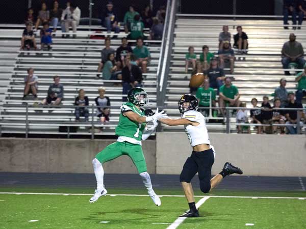 Burnet’s Sterling Galban battles a Gatesville defender for the ball during the Bulldogs-Gatesville game Oct. 14. The Bulldogs won the game, 38-35, in the second over time. Burnet head to Liberty Hill where they’ll face the Panthers on Friday, Oct. 21 with a 7:30 p.m. kick off. Photo by Glenn Morris/FTMOG.com
