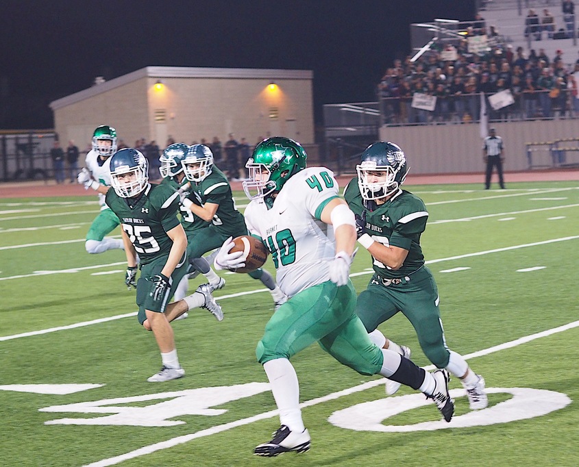 Burnet's Preston Reeves rumbles for some yards late in the game against the Taylor Ducks on Friday, Nov. 11, at Bible Stadium in Leander. The Ducks beat the Bulldogs 42-6 in the first round of the playoffs. Staff photo by Daniel Clifton