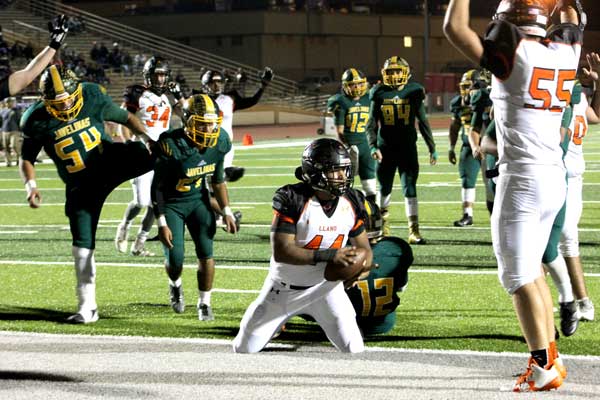 Llano High School junior fullback John Soliz was stopped a yard short of the end zone — though junior left tackle Ray Dixon signals a touchdown — during the Yellow Jackets’ 22-18 loss to Crystal City on Nov. 10 in a Class 4A Division II bi-district championship. Junior running back Mason Greenwood scored on the next play. Staff photos by Jennifer Fierro
