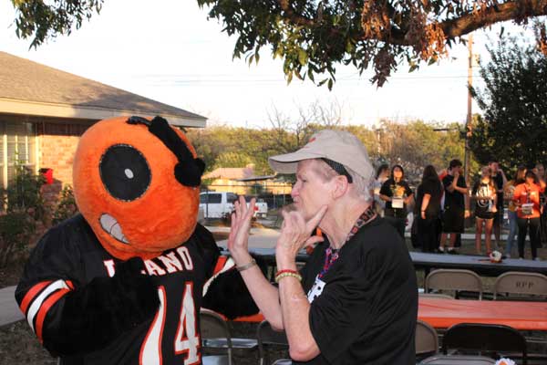 Mary Lou Grenwelge, a resident at Llano Nursing and Rehabilitation Center, gets the best of the Llano High School mascot.