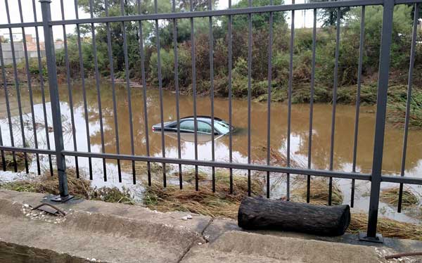 Two people got out of this vehicle safely after it stalled at a flooded low-water crossing Nov. 8 just off U.S. 281 on Nature Heights in Marble Falls. Shortly thereafter, swift water swept the vehicle down an adjacent creek, submerging it behind a business in the 2700 block of Commerce Street. Courtesy photo