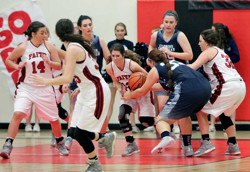 Faith Academy of Marble Falls senior guard Addison Floyd takes the ball away from Cypress Christian post Kaylee Martinez during the Lady Flames’ 68-41 win Feb. 14. Photo by Kelly McDuffie/kellymcduffiephotography.com