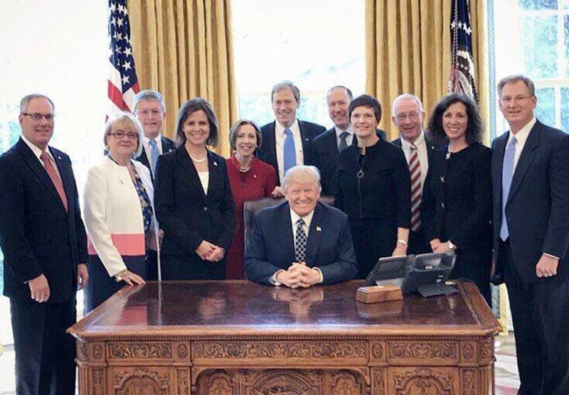 FirstCapital Bank of Texas president and American Bank Association chairman-elect Ken Burgess (left) of Horseshoe Bay and Midland joined other ABA officials Laurie Stewart, Jeff Szyperski, Luanne Cundiff, Dorothy Savarese, Rob Nichols, Leslie Andersen, Tim Zimmerman, Rebeca Romero, and Scott Heittkamp with President Donald Trump in the Oval Office following a meeting March 9. The president invited ABA officials and community bank representatives to the meeting so he could hear their concerns and challenges. Courtesy photo