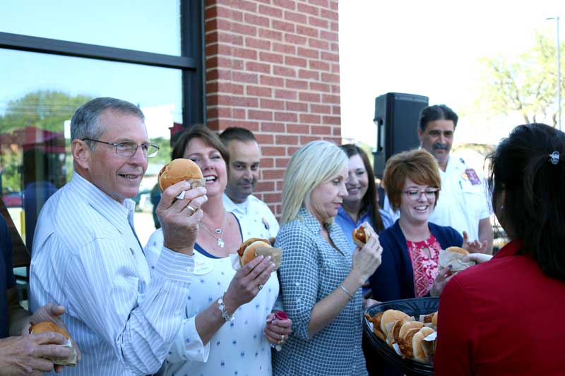 Chick-fil-A Highland Lakes opened its doors for business April 27. Shortly after 9 a.m., owner Alan Williams (left) and wife Inda celebrated with a ‘First Bite’ ceremony. City and community leaders gathered for the ribbon-cutting ceremony and also took part in the tradition. Staff photo by Jared Fields