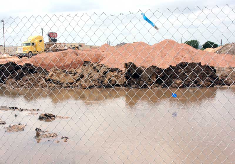 A water main break on May 19 at the H-E-B construction site resulted in temporary disconnected water service in a section of Marble Falls Middle School and the existing H-E-B as well as lowered water pressure in a portion of the Northwood subdivision. Staff photo by Connie Swinney