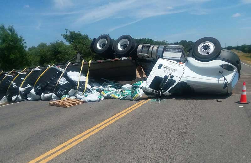 A truck carrying bags of fertilizer rolled over May 15, delaying traffic for about three hours. Courtesy photo