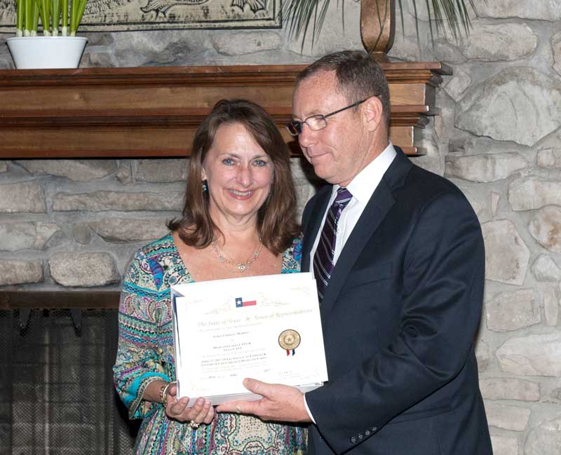 Texas State Rep. Terry Wilson (R-Granite Shoals) presents Judge Cheryll Mabray (left) of the Texas Child Protection Court of the Hill Country with a CASA for the Highland Lakes Area service award. Mabray has spent her career as a county attorney and now an associate judge serving abuse and neglected children. CASA for the Highland Lakes Area serves Burnet, Blanco, Llano, Lampasas, and San Saba counties. Courtesy photo