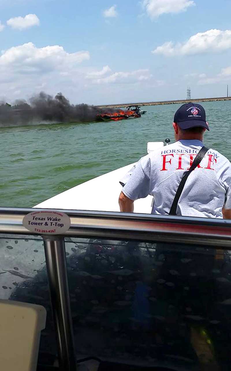 Officials do not suspect foul play in a boat fire June 9 during which four occupants escaped into the water on Lake LBJ in Burnet County. Authorities towed the vessel to shore, where fire crews doused the blaze before the boat sunk to the bottom. Courtesy photo