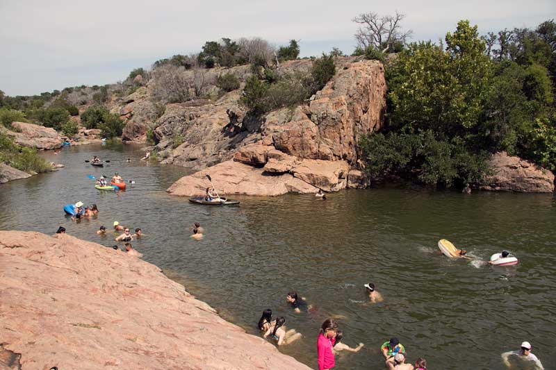 Swimmers cool off at the Devil’s Waterhole in Inks Lake State Park. With temperatures and heat indices in the triple-digits this week, a Highland Lakes swimming hole is the perfect place to beat the heat. Check out a list of places to swim at 101HighlandLakes.com/swimming-holes. Staff photo by Jared Fields
