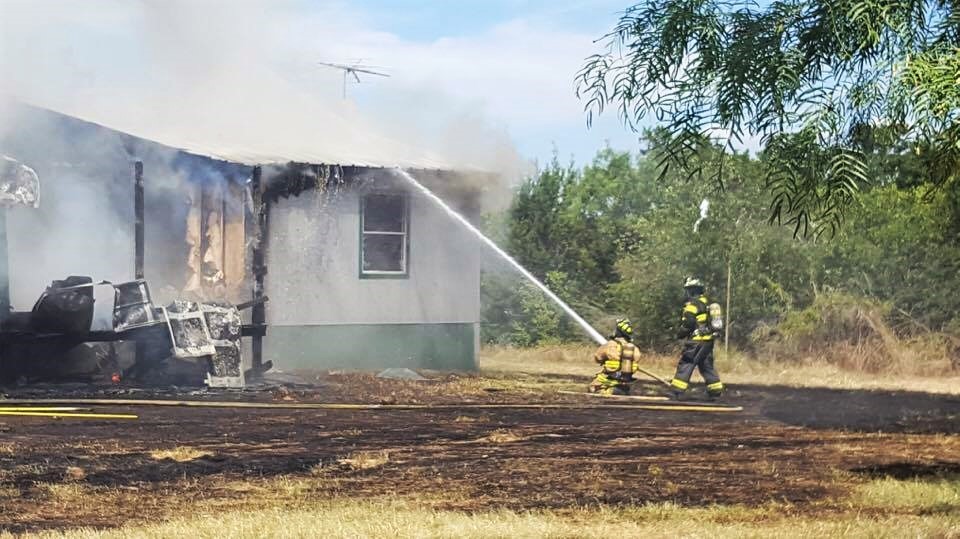 Three Camp Champion staff members evacuated a building used as living quarters before a blaze destroyed the structure on July 11 on the property off Highland Drive in Highland Haven. Courtesy photo by Ashlin Broussard