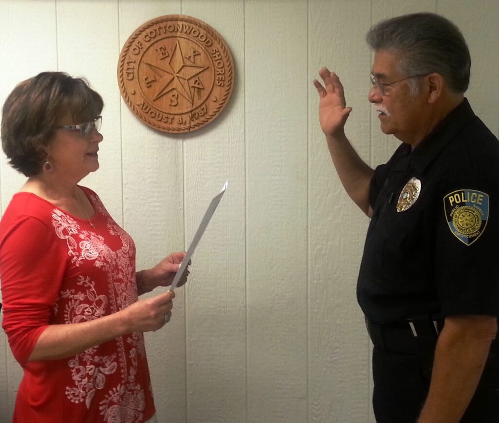 Cottonwood Shores City Administrator Sheila Moore (left) recently swore in the newly selected police Chief Johnny Liendo, whose first day with the city was July 11. Courtesy photo