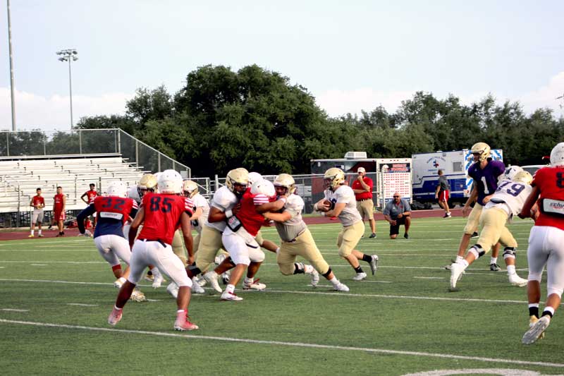 Marble Falls High School sophomore running back Gabriel Barker looks for hole on the first offensive play against Georgetown East View in a scrimmage Aug. 25. The Mustangs open the season against Bastrop Cedar Creek at noon Saturday, Sept. 2, at Bastrop Memorial Stadium, 755 Texas 21 West in Cedar Creek. Staff photo by Jennifer Fierro