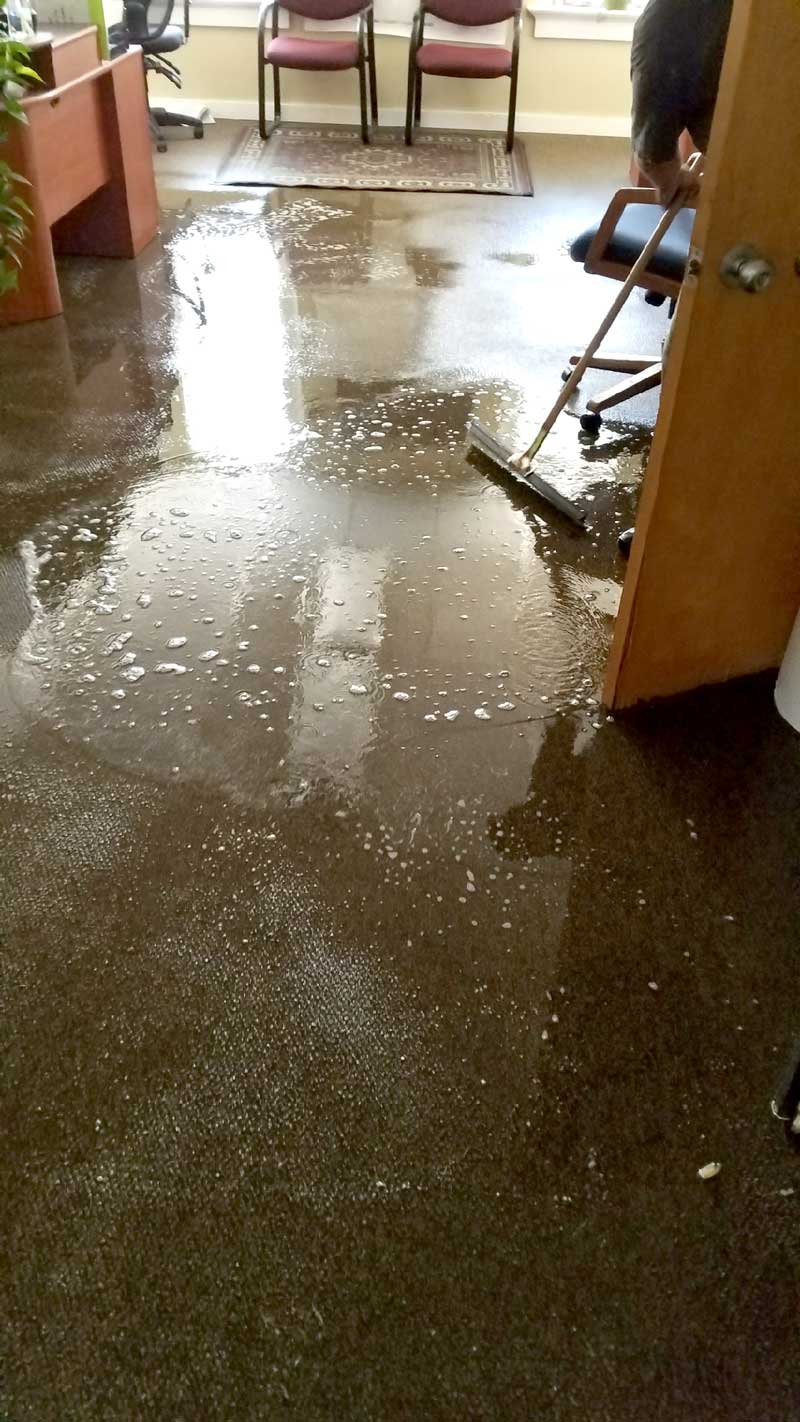 Llano County officials temporarily shuttered some county offices after a ruptured water pipe damaged floors and ceilings of a county building just off the courthouse square in Llano. Courtesy photo