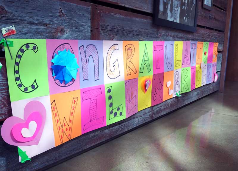 Texas Pecan Cake Shop won first place Aug. 11 in the 2017 H-E-B Primo Picks Quest for Texas Best contest. Several Bertram-area children made a congratulations banner for shop owners Will and Bridget McCoy. The win gives the McCoys a good shot at getting their cakes on the shelves of H-E-B grocery stores starting in 2018. Staff photo by Daniel Clifton