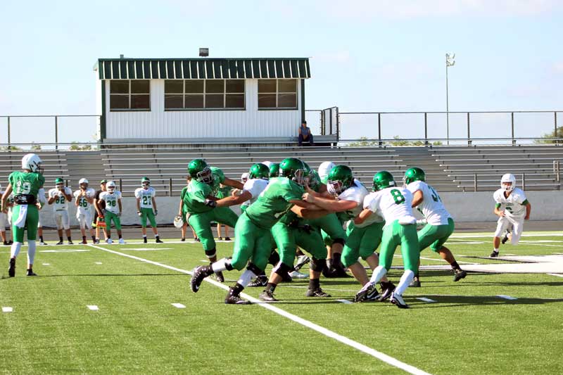 The Burnet High School varsity scrimmage Aug. 12 featured projected starters on both sides of the ball, including the offensive and defensive lines. The defense didn’t give up a first down until the final drive of the hour-long intersquad scrimmage. Staff photo by Jennifer Fierro