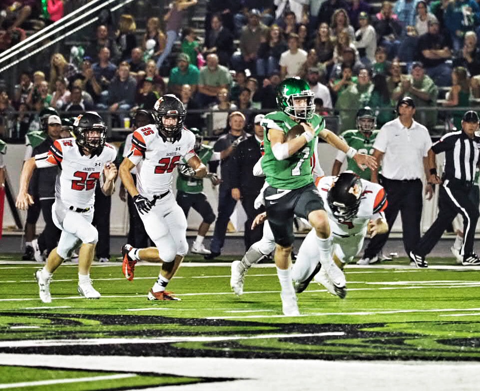 With Llano Yellow Jackets in pursuit, Burnet’s Chandler Galban picks up some yardage during the first half of the squads’ Sept. 29 game at Bulldog Field. Burnet won 31-21. Photo by Glenn Morris/FTMOG.com