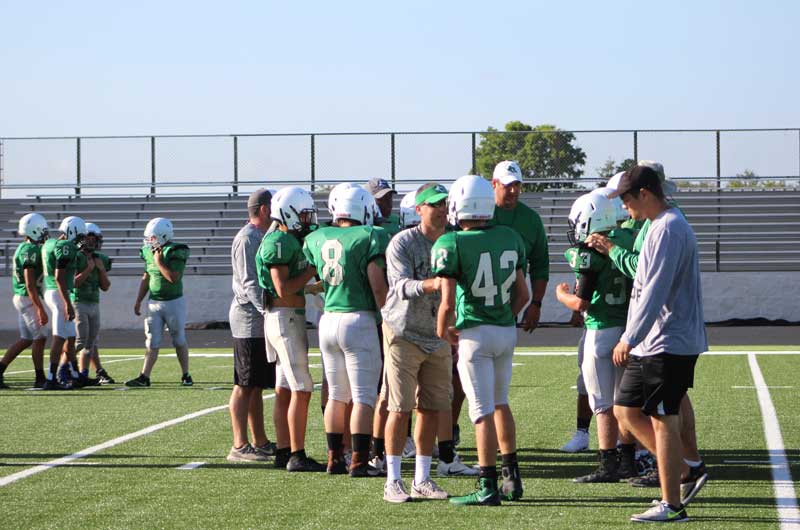 Burnet High School head football coach Kurt Jones (center) talks of the importance of running with a purpose during team practices. The Bulldogs host the Llano Yellow Jackets on Sept. 29 on homecoming. Kickoff is 7:30 p.m. at Bulldog Field, 1000 The Green Mile in Burnet. Staff photo by Jennifer Fierro